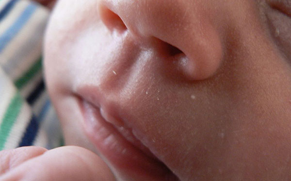 a close-up image of a baby's nose and mouth