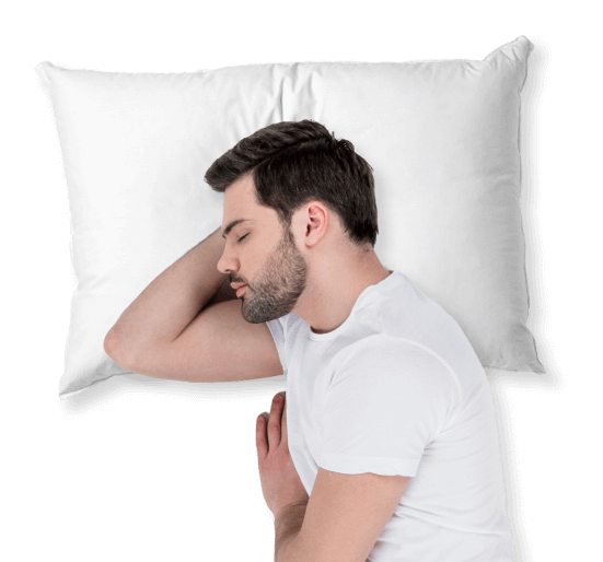 a man sleeping on his side on a white pillow